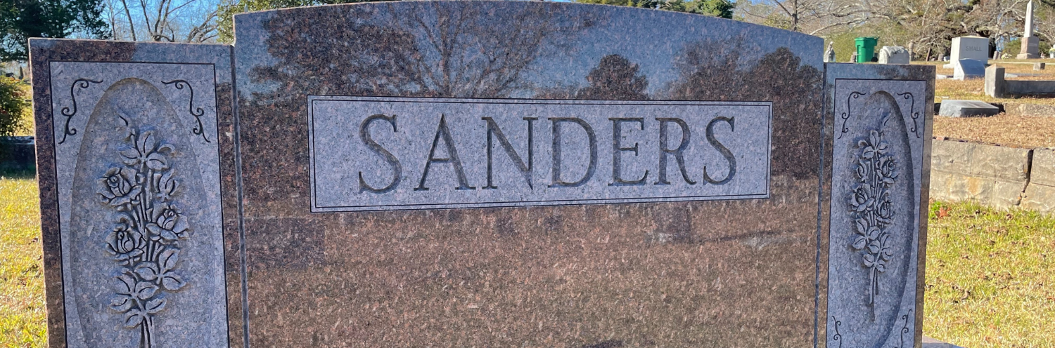 Engraved headstone in colored granite 